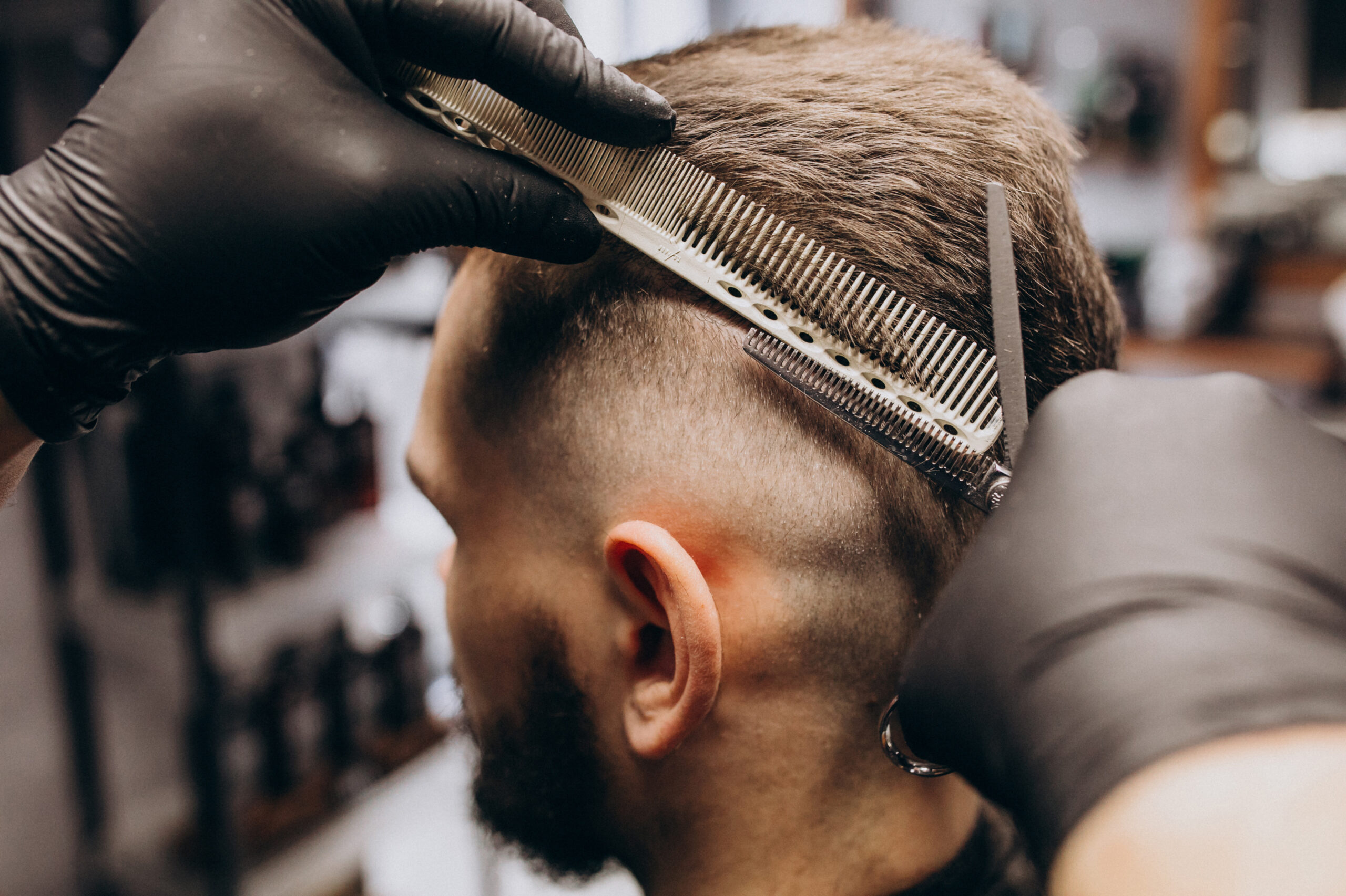 Client doing hair cut at a barber shop salon Your Identity